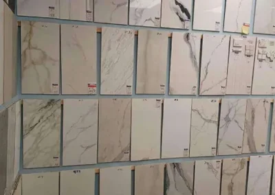 Wall of various marble-patterned tiles displayed in a store-5